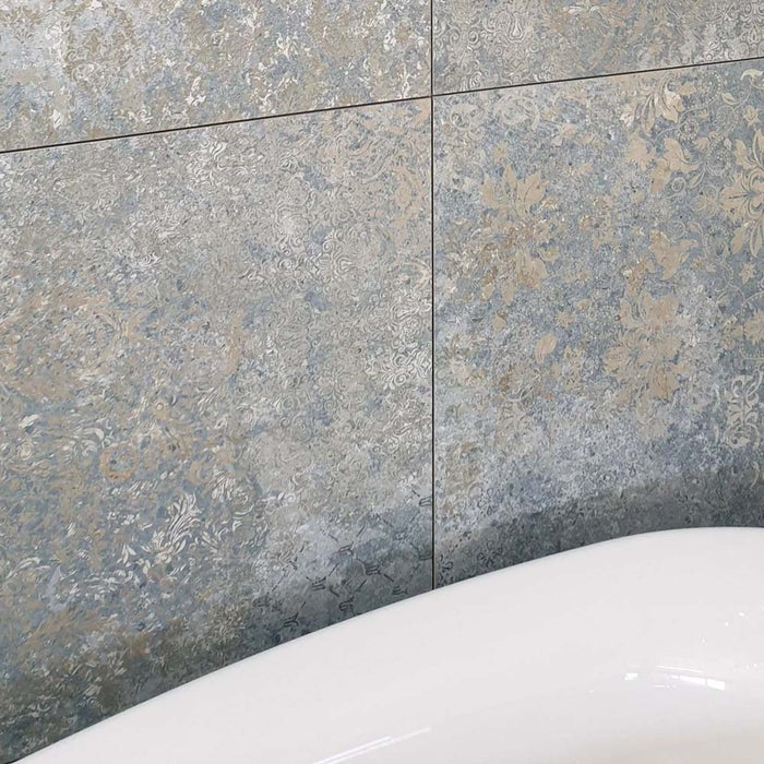 Close-up of Boho Ocean Blue 60 × 60cm patterned tiles, featuring layered blue and neutral tones with a softly worn, decorative effect. Ideal for adding texture and character to bathroom walls, floors, or statement feature areas.