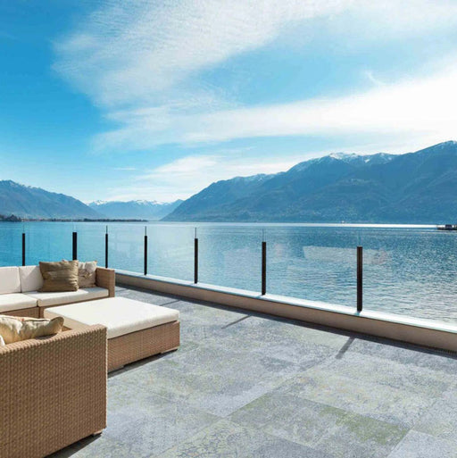 Outdoor terrace featuring Boho Ocean Blue 2cm 50 × 100cm patterned slabs, blending soft blue and natural tones with a lightly weathered effect. Ideal for patios and outdoor living areas, creating a calm, seamless connection to the surrounding landscape.