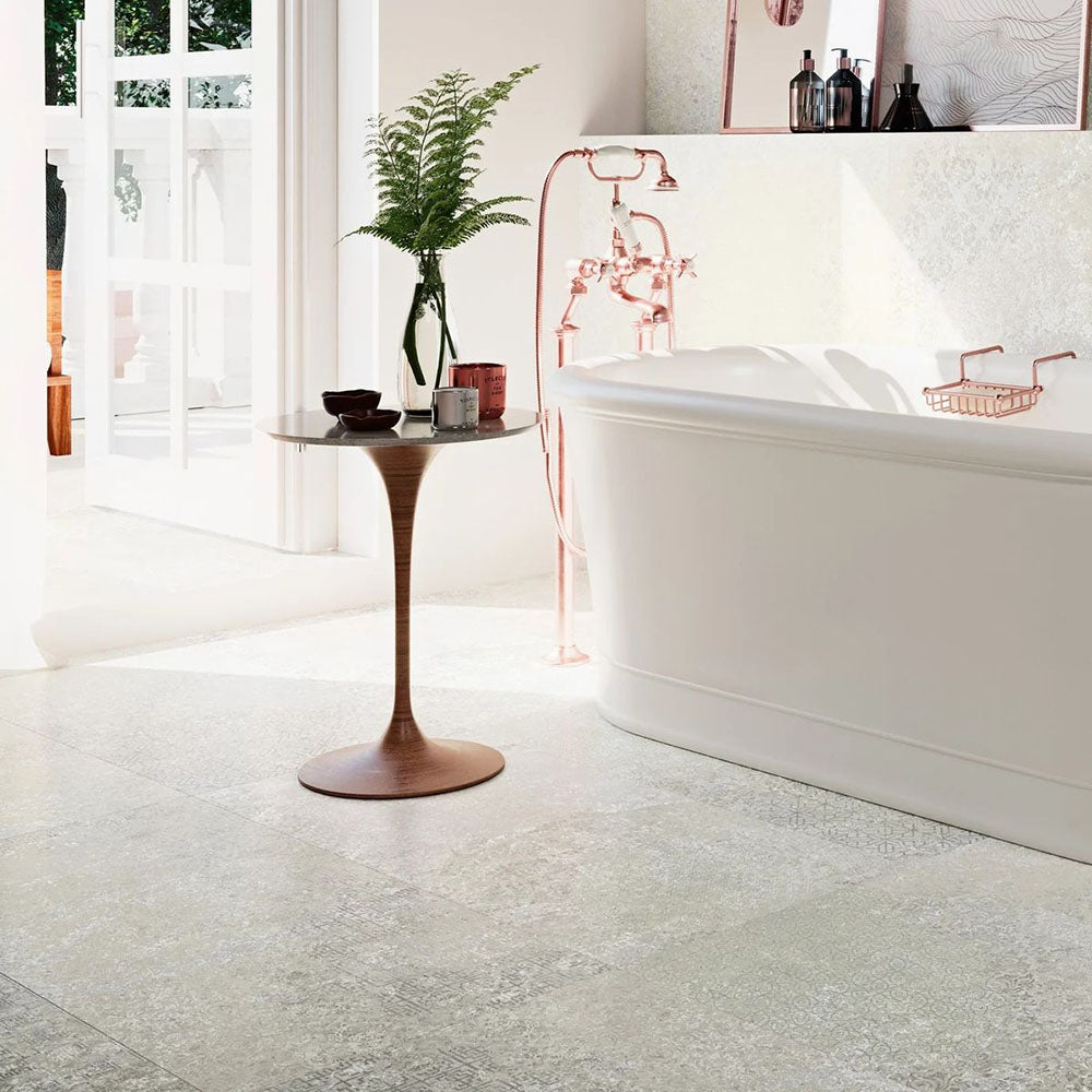 Bathroom interior featuring Boho Ocean Sahara 60 × 60cm patterned tiles, blending soft neutral tones with a lightly worn, decorative effect. Ideal for creating calm, characterful floors in bathrooms, kitchens, or relaxed living spaces.