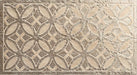 Close-up of Ourika Sandy Beach Moroccan style decorative porcelain wall tile, featuring an intricate carved geometric floral pattern in soft sandy beige and taupe tones with textured engraved detailing and a gently aged finish, perfect for creating statement bathroom walls, kitchen splashbacks and feature walls with timeless Moroccan-inspired character.