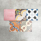 Fayrouz Patchwork 20×20cm Moroccan-style porcelain tiles arranged in a colourful patchwork mix of geometric and floral patterns, featuring rich tones of blue, green, pink and warm neutrals.