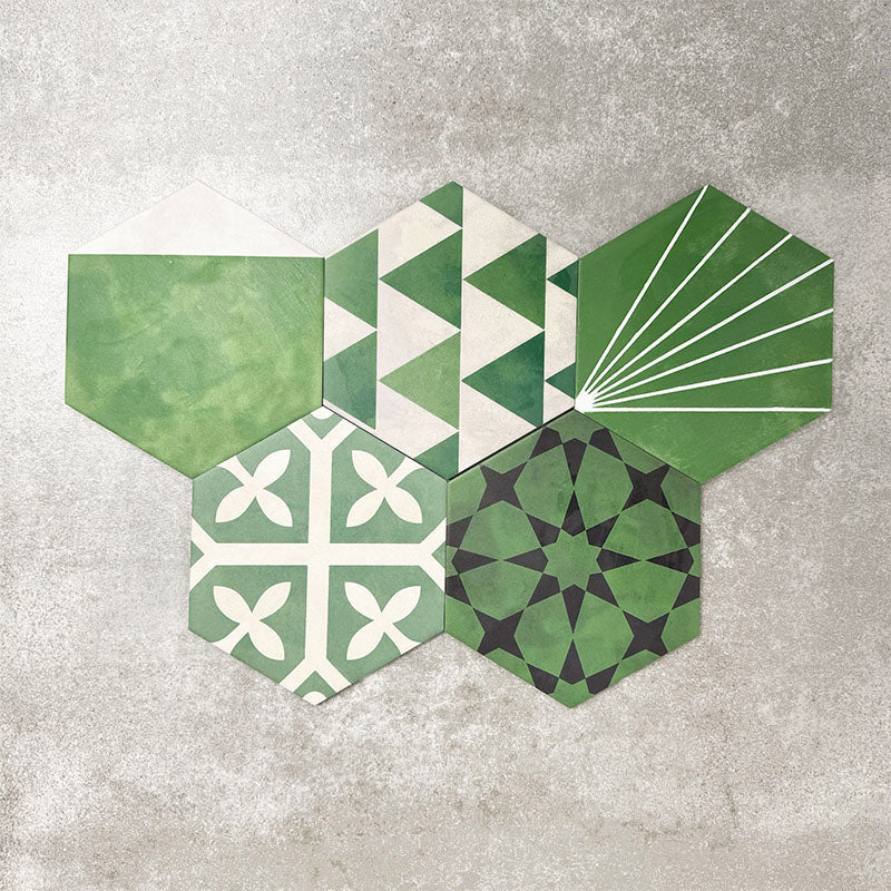 Fayrouz Verde Hexagon Patchwork Moroccan-style porcelain tiles in an 18.7 × 21.6cm hexagon format, showcasing a coordinated mix of geometric, starburst and zigzag patterns in layered green, sage, mint and charcoal tones, arranged as a decorative patchwork group to highlight colour variation and pattern diversity.