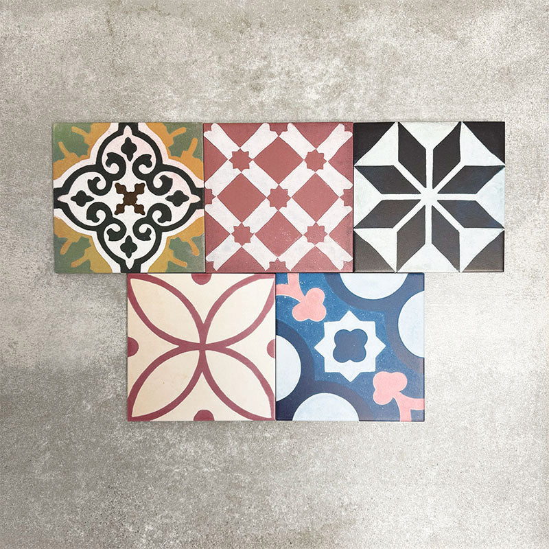 Fayrouz Patchwork 20×20cm Moroccan-style porcelain tiles arranged in a colourful patchwork mix of geometric and floral patterns, featuring rich tones of blue, green, pink and warm neutrals.
