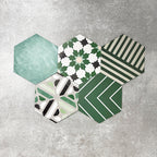 Fayrouz Verde Hexagon Patchwork Moroccan-style porcelain tiles in an 18.7 × 21.6cm hexagon format, showcasing a coordinated mix of geometric, starburst and zigzag patterns in layered green, sage, mint and charcoal tones, arranged as a decorative patchwork group to highlight colour variation and pattern diversity.