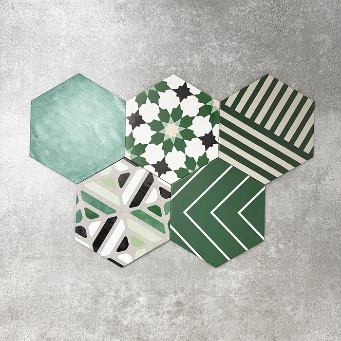 Fayrouz Verde Hexagon Patchwork Moroccan-style porcelain tiles in an 18.7 × 21.6cm hexagon format, showcasing a coordinated mix of geometric, starburst and zigzag patterns in layered green, sage, mint and charcoal tones, arranged as a decorative patchwork group to highlight colour variation and pattern diversity.