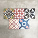Fayrouz Patchwork 20×20cm Moroccan-style porcelain tiles arranged in a colourful patchwork mix of geometric and floral patterns, featuring rich tones of blue, green, pink and warm neutrals.