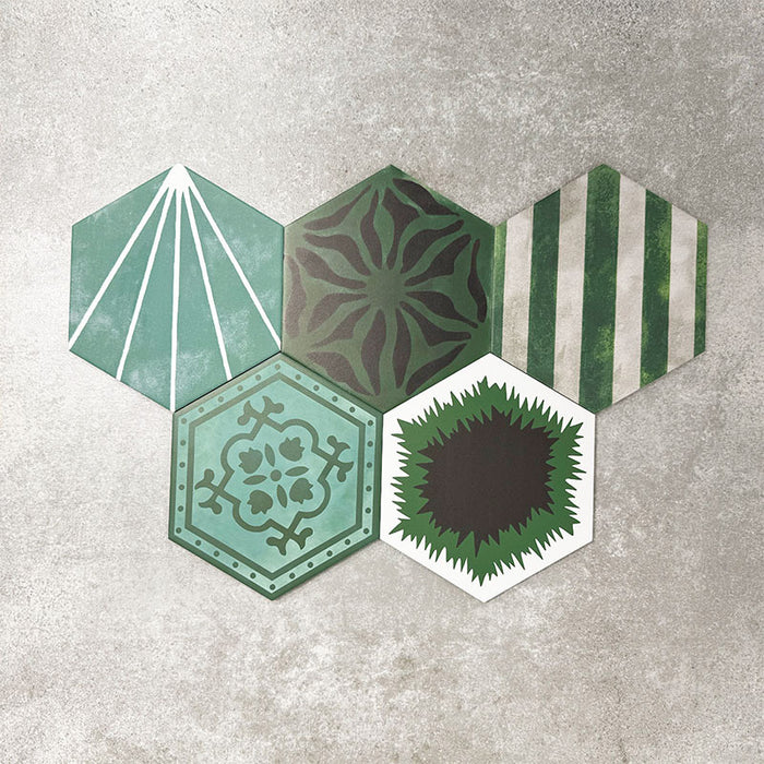Fayrouz Verde Hexagon Patchwork Moroccan-style porcelain tiles in an 18.7 × 21.6cm hexagon format, showcasing a coordinated mix of geometric, starburst and zigzag patterns in layered green, sage, mint and charcoal tones, arranged as a decorative patchwork group to highlight colour variation and pattern diversity.