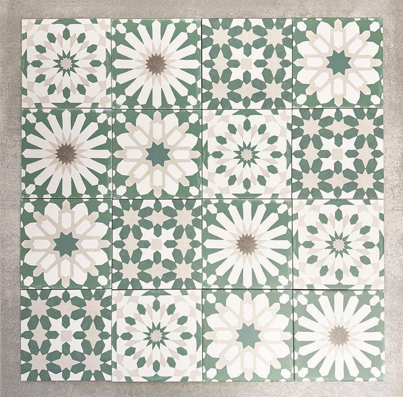 Souk Green B 20×20cm Moroccan-style porcelain patchwork tiles featuring mixed green, white and beige geometric patterns.