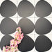 Pebbles Reversed Black 20x20cm porcelain Moroccan-style tiles featuring bold abstract black shapes on a soft white background, designed to create striking statement walls and contemporary patterned interiors.