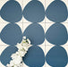 Pebbles Reversed Blue 20x20cm porcelain Moroccan-style tiles featuring bold organic blue shapes on a soft white background, designed to create playful statement walls and contemporary patterned interiors.