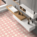 Bathroom featuring Pebbles Reversed Pink 20x20cm porcelain Moroccan-style floor tiles with soft blush abstract patterning, paired with wood accents, floating white cabinetry, and minimalist contemporary styling.