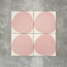 Pebbles Reversed Pink 20x20cm porcelain Moroccan-style tiles featuring soft blush abstract shapes on a warm white background, designed to create playful statement walls and contemporary patterned interiors.