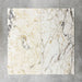 Close-up of Fayrouz Picasso natural marble tiles in a honed finish, 30.5x61cm format, showcasing a soft white base with warm beige undertones and distinctive veining, creating a refined and elegant look for wall and floor applications.