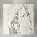 Close-up of Fayrouz Picasso natural marble tiles in a honed finish, 30.5x61cm format, showcasing a soft white base with warm beige undertones and distinctive veining, creating a refined and elegant look for wall and floor applications.