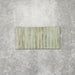 Product display of Pottery Decor Agave Green 12.5x25cm ceramic wall tiles in soft green tones, featuring a linear fluted design, handcrafted glossy finish and subtle tonal variation for textured contemporary interiors.