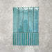 Product display of Pottery Decor Azul Blue 12.5x25cm ceramic wall tiles in vibrant blue tones, featuring a handcrafted glossy finish with coordinating fluted decorative tiles for textured contemporary interiors.