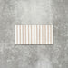 Product display of Pottery Decor Blanco 12.5x25cm ceramic wall tiles in soft white tones, featuring a linear fluted design, handcrafted glossy finish and subtle tonal variation for textured contemporary interiors.