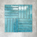 Product display of Pottery Brick Azul Blue 5x25cm glossy wall tiles in vibrant blue tones, arranged in a basketweave layout with handcrafted edges and tonal variation against a textured concrete-style backdrop.