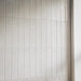 Close-up of Pottery Brick Blanco 5 × 25cm ceramic wall tiles, featuring soft white tones, subtle tonal variation, and a glossy handcrafted finish in a slim brick format for a refined contemporary wall design.