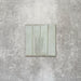 Product image of Puzzle Breeze Green Brick Rectified 5x20cm wall and floor tiles, featuring a glossy pale green finish with subtle tonal variation and softly aged edges, displayed to highlight the tile's handcrafted character.