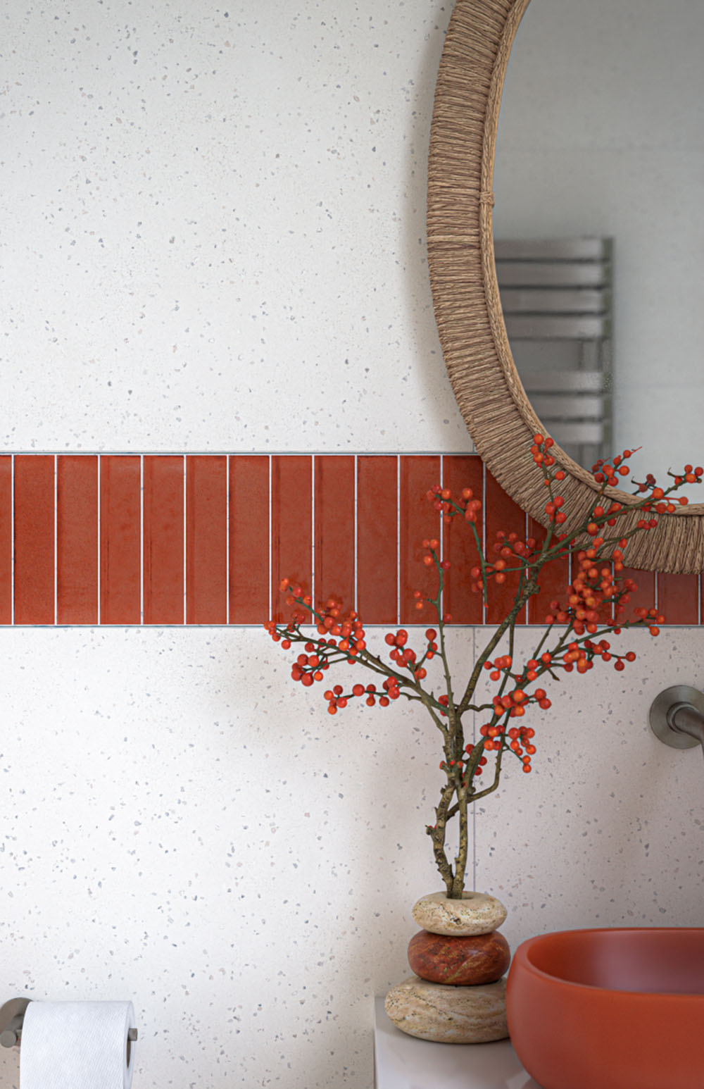 Puzzle Coral Brick Rectified 5cm x 20cm tiles used as a colourful horizontal feature strip in a modern bathroom, pairing warm coral tones with large neutral tiles, a coral basin and matching wall-mounted toilet.