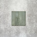 Product image of Puzzle Sage Green Brick Rectified 5x20cm wall and floor tiles, featuring a glossy sage green finish with subtle tonal variation and softly aged edges, displayed to highlight the tile's handcrafted character.