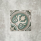 Single London Streets Regent Street 20x20cm Victorian Moroccan style porcelain tile displayed in a product setting, featuring a decorative floral-inspired geometric pattern in green, sage and cream tones inspired by traditional Victorian style floor tiles.