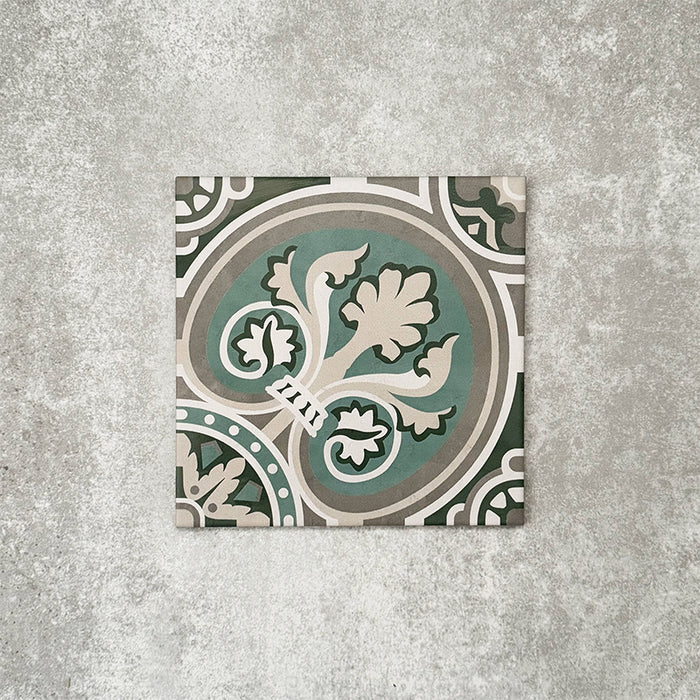 Single London Streets Regent Street 20x20cm Victorian Moroccan style porcelain tile displayed in a product setting, featuring a decorative floral-inspired geometric pattern in green, sage and cream tones inspired by traditional Victorian style floor tiles.