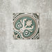 Single London Streets Regent Street 20x20cm Victorian Moroccan style porcelain tile displayed in a product setting, featuring a decorative floral-inspired geometric pattern in green, sage and cream tones inspired by traditional Victorian style floor tiles.