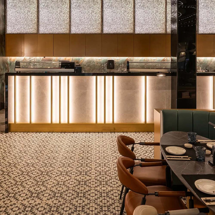 Restaurant interior featuring Abbey Black & White A 28×28cm Victorian-style patterned porcelain mosaic floor tiles.