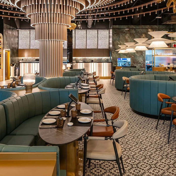 Restaurant interior featuring Abbey Black & White A 28×28cm Victorian-style patterned porcelain mosaic floor tiles.