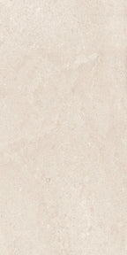 Close-up of Riad Avorio Neutra Stone 30x60cm stone-effect wall and floor tile, featuring warm ivory and beige tones with delicate natural stone-inspired veining and a subtle, elegant textured finish.