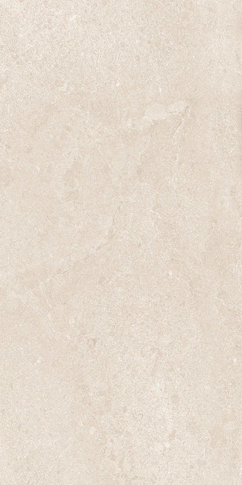 Close-up of Riad Avorio Neutra Stone 30x60cm stone-effect wall and floor tile, featuring warm ivory and beige tones with delicate natural stone-inspired veining and a subtle, elegant textured finish.