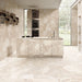 Contemporary kitchen featuring Riad Avorio Sassi Terrazzo Stone 60x120cm stone-effect wall and floor tiles, showcasing warm ivory and beige tones with natural stone-inspired detailing, paired with a matching waterfall island, integrated cabinetry and floor-to-ceiling glazing.