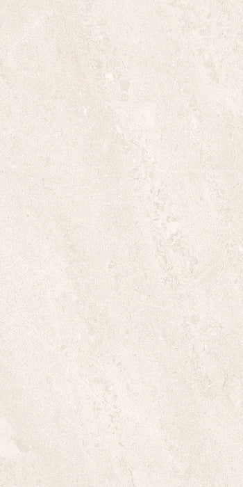 Close-up of Riad Blanco Neutra Stone 30x60cm stone-effect wall and floor tile, featuring soft cream and ivory tones with delicate natural stone-inspired veining and a subtle, elegant textured finish.
