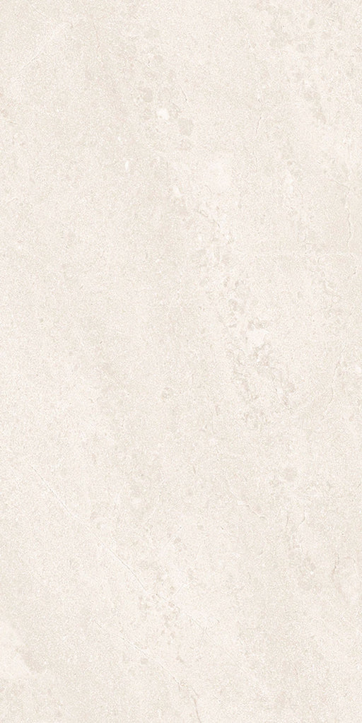 Close-up of Riad Blanco Neutra Stone 30x60cm stone-effect wall and floor tile, featuring soft cream and ivory tones with delicate natural stone-inspired veining and a subtle, elegant textured finish.