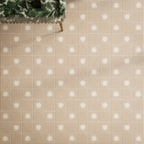 Close-up of Rubins Gold Base MINI 15x15cm Moroccan-style porcelain floor tiles, featuring warm sandy beige tones in a square grid layout, paired with white star-patterned decor tiles, natural greenery and brass accents.