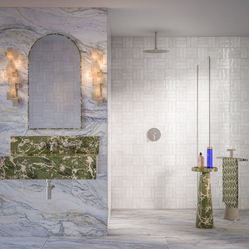 Bathroom interior featuring Foundry Bricks Chalk White 6.5x20cm wall tiles, laid in a structured patterned layout across shower walls, paired with marble effect floor tiles and a green marble vanity for a refined, design-led finish.