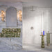 Bathroom interior featuring Foundry Bricks Chalk White 6.5x20cm wall tiles, laid in a structured patterned layout across shower walls, paired with marble effect floor tiles and a green marble vanity for a refined, design-led finish.