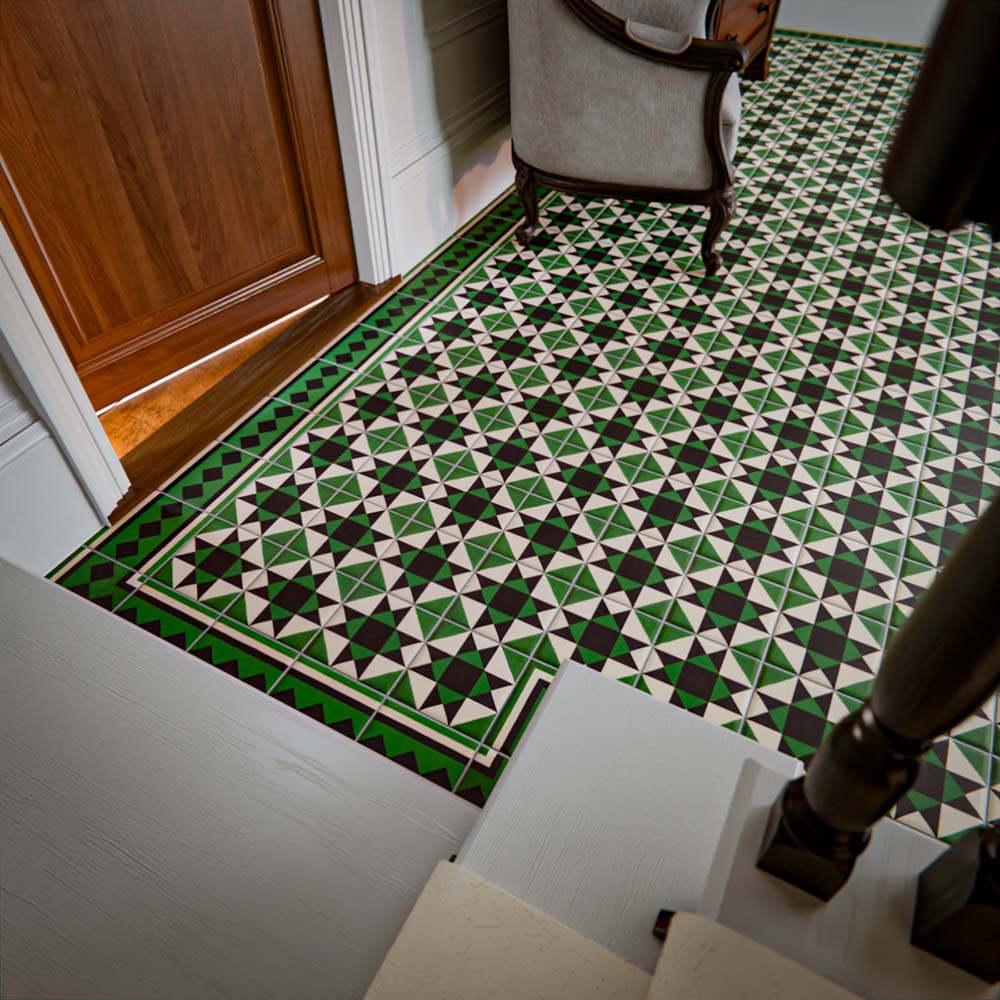 Greenbrook Manor corner 20cm x 20cm porcelain tiles creating a green, black and white Victorian-style geometric corner detail around a patterned tiled floor in a traditional hallway setting.