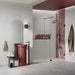 Contemporary bathroom featuring Shards Blanco 3D Terrazzo 60x120cm porcelain wall tiles, showcasing a white terrazzo effect with textured 3D stone chips, paired with a burgundy feature basin, pink gloss shower tiles, black fittings and a frameless walk-in shower.