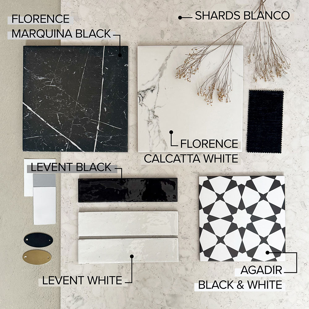 Moodboard featuring Shards Blanco 3D Terrazzo 60x120cm porcelain tiles, paired with Florence Marquina Black and Calcatta White marble effect tiles, Levent gloss brick tiles, Agadir Black & White patterned tiles, black fabric, brass accents and dried botanicals.