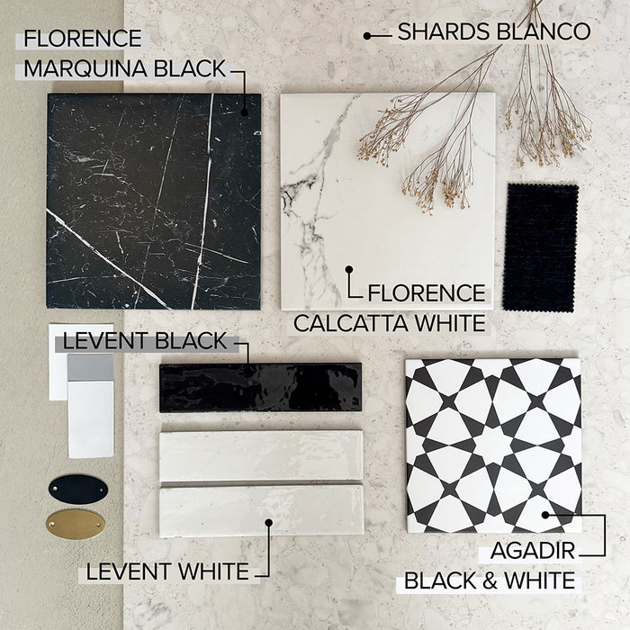 Moodboard featuring Shards Blanco 3D Terrazzo 60x120cm porcelain tiles, paired with Florence Marquina Black and Calcatta White marble effect tiles, Levent gloss brick tiles, Agadir Black & White patterned tiles, black fabric, brass accents and dried botanicals.