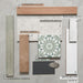 Moodboard featuring Shards Blanco 3D Terrazzo 60x120cm porcelain tiles, paired with Jumairah Clay and Green gloss brick tiles, Fez Jade patterned tiles, Oviedo Brick terracotta-effect tiles, Brooklyn White and Benomar White wall tiles, with dark grey and brushed metal accents.