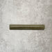 Nomad Sage Green bullnose pencil border ceramic tile in a 3 × 20cm format, featuring a glossy glaze and subtle colour variation, ideal for finishing edges and transitions alongside matching brick wall tiles.