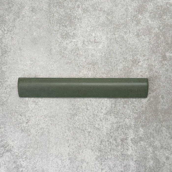 Zellige Malachite Green 3×20cm Moroccan-style ceramic bullnose tile, showcasing the rounded edge profile, rich green glaze and subtle tonal variation on a neutral background.