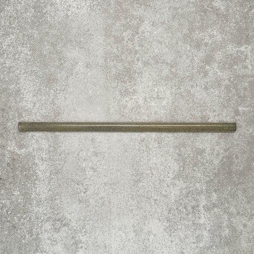Single Allegra Daisy Green Gloss pencil bullnose border ceramic tile in a 1.2 × 30cm format, shown horizontally to highlight the slim profile, glossy glaze and natural green tonal variation.