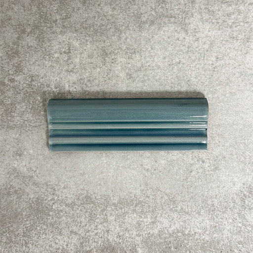 Pimlico River Blue dado trim tile measuring 5 × 15cm, finished with a crackle glaze and deep blue tone, designed to add a decorative feature line and classic detailing to ceramic wall tile installations.