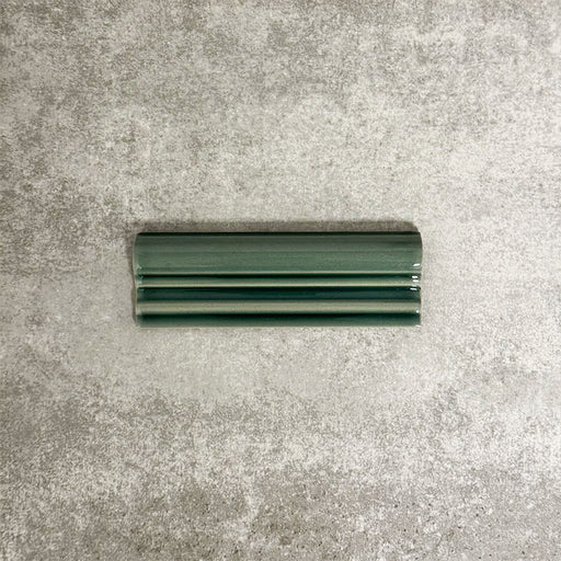 Pimlico Golders Green dado trim tile measuring 5 × 15cm, finished with a crackle glaze and rich green tone, designed to add a decorative feature line and classic detailing to ceramic wall tile installations.