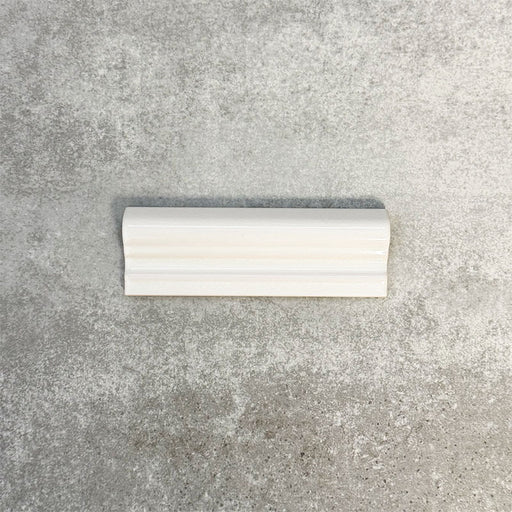 Pimlico White dado trim tile measuring 5 × 15cm, finished with a crackle glaze and soft white tone, designed to add a decorative feature line and classic detail to ceramic wall tile layouts.